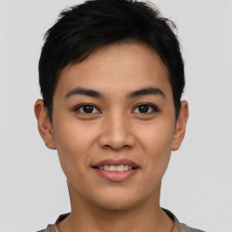 Joyful asian young-adult male with short  black hair and brown eyes