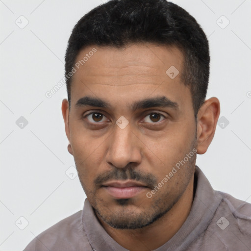 Neutral latino young-adult male with short  black hair and brown eyes