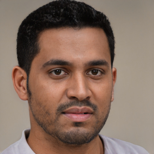 Neutral black young-adult male with short  black hair and brown eyes