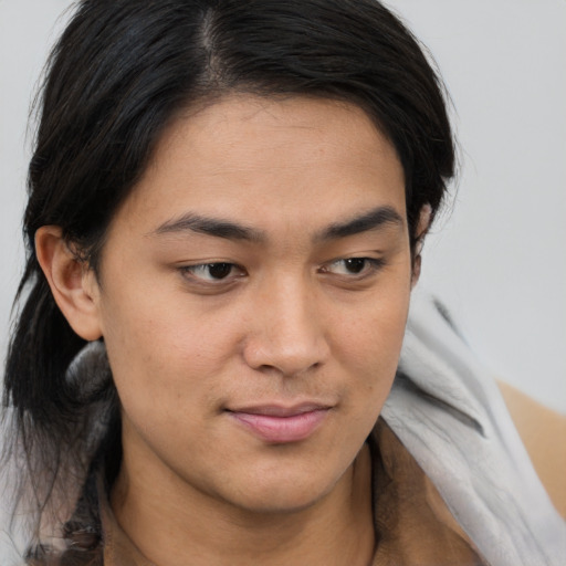 Joyful asian young-adult male with medium  brown hair and brown eyes