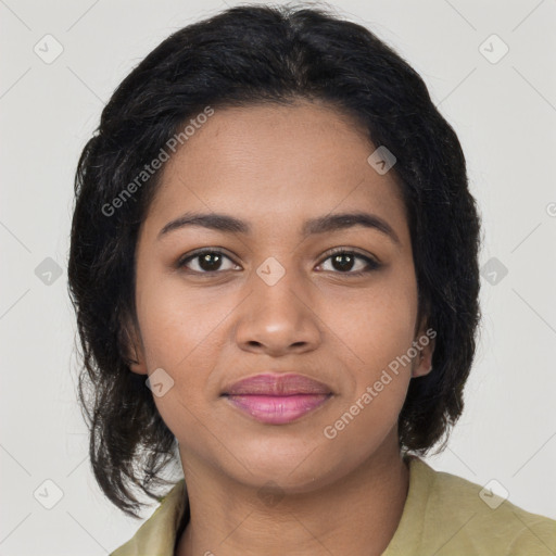 Joyful black young-adult female with medium  brown hair and brown eyes