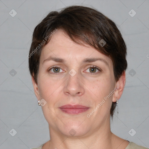 Joyful white adult female with short  brown hair and grey eyes