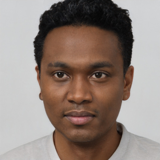 Neutral black young-adult male with short  black hair and brown eyes