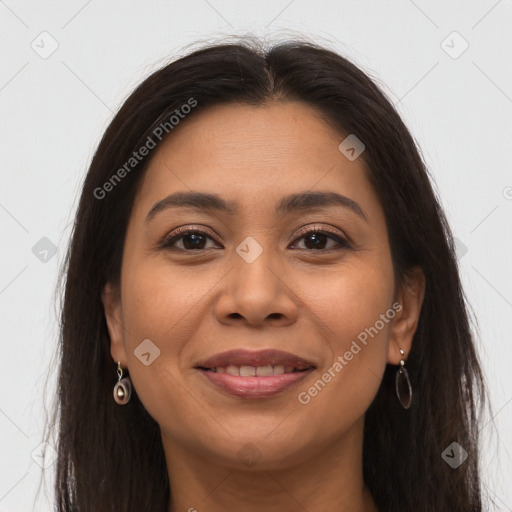 Joyful latino young-adult female with long  brown hair and brown eyes