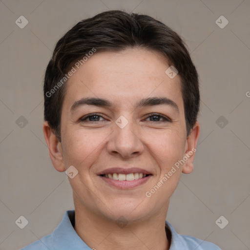 Joyful white young-adult female with short  brown hair and brown eyes