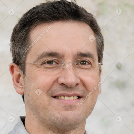 Joyful white adult male with short  brown hair and grey eyes