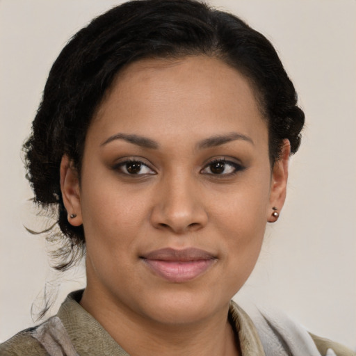 Joyful latino young-adult female with short  brown hair and brown eyes