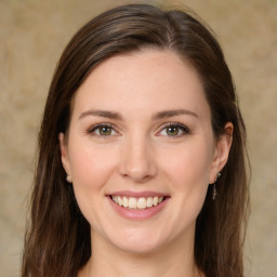 Joyful white young-adult female with medium  brown hair and green eyes