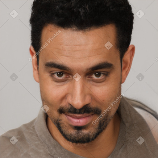 Joyful white young-adult male with short  black hair and brown eyes