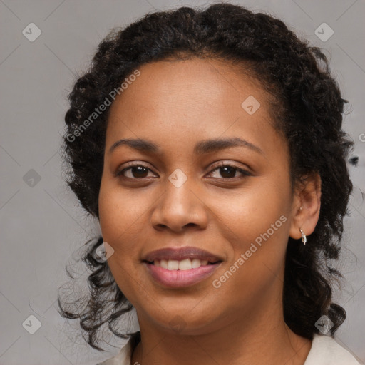 Joyful black young-adult female with medium  brown hair and brown eyes