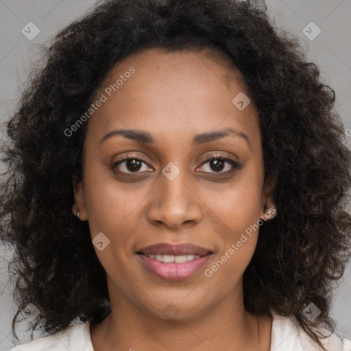 Joyful black young-adult female with medium  brown hair and brown eyes