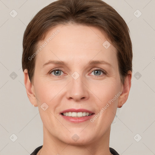 Joyful white adult female with short  brown hair and grey eyes