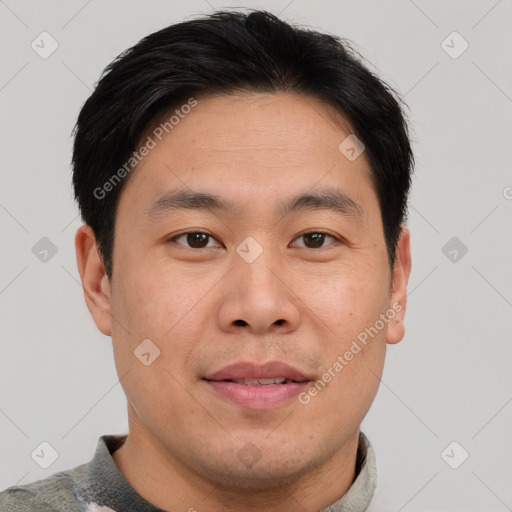 Joyful asian young-adult male with short  brown hair and brown eyes