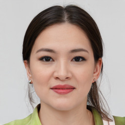 Joyful asian young-adult female with medium  brown hair and brown eyes