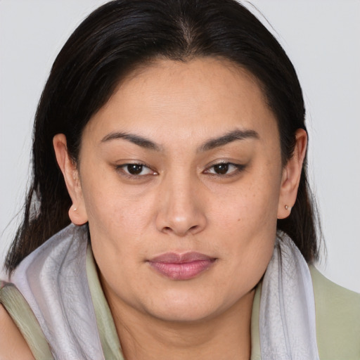 Joyful asian young-adult female with medium  brown hair and brown eyes