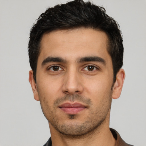 Neutral white young-adult male with short  black hair and brown eyes
