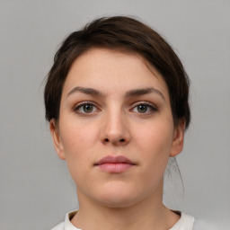 Neutral white young-adult female with short  brown hair and brown eyes