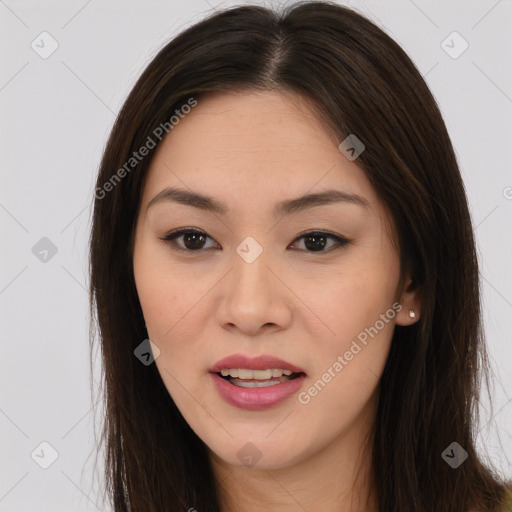 Joyful asian young-adult female with long  brown hair and brown eyes