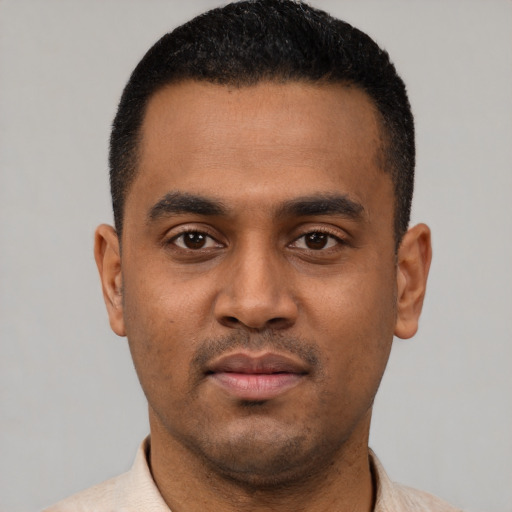 Neutral latino young-adult male with short  black hair and brown eyes