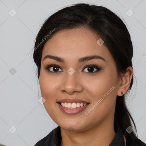 Joyful asian young-adult female with long  brown hair and brown eyes