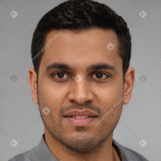 Joyful latino young-adult male with short  black hair and brown eyes