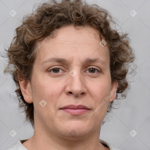 Joyful white adult female with medium  brown hair and blue eyes