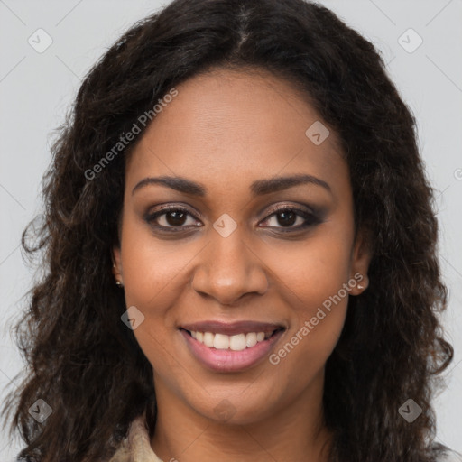 Joyful black young-adult female with long  brown hair and brown eyes