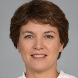 Joyful white adult female with short  brown hair and brown eyes