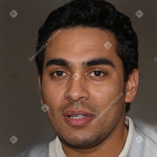 Joyful latino young-adult male with short  black hair and brown eyes
