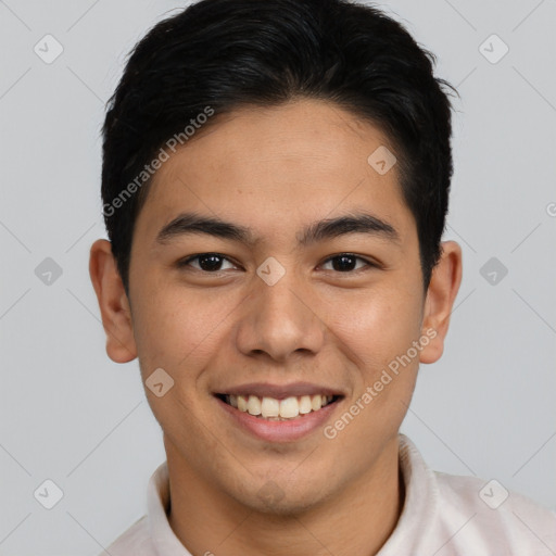 Joyful latino young-adult male with short  brown hair and brown eyes