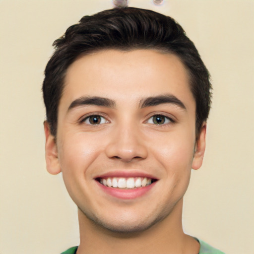 Joyful white young-adult male with short  black hair and brown eyes