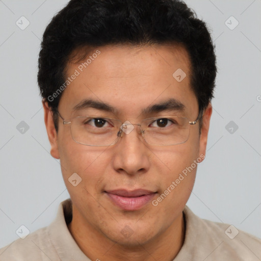 Joyful latino adult male with short  brown hair and brown eyes