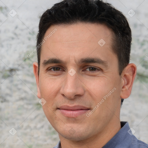 Joyful white adult male with short  brown hair and brown eyes