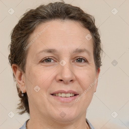 Joyful white adult female with short  brown hair and brown eyes