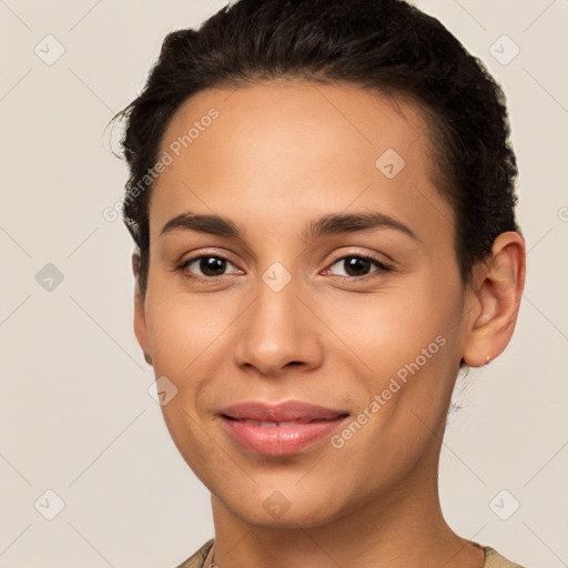 Joyful latino young-adult female with short  brown hair and brown eyes