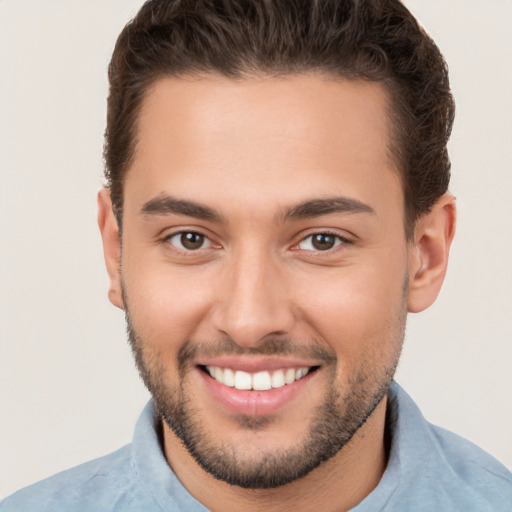 Joyful white young-adult male with short  brown hair and brown eyes