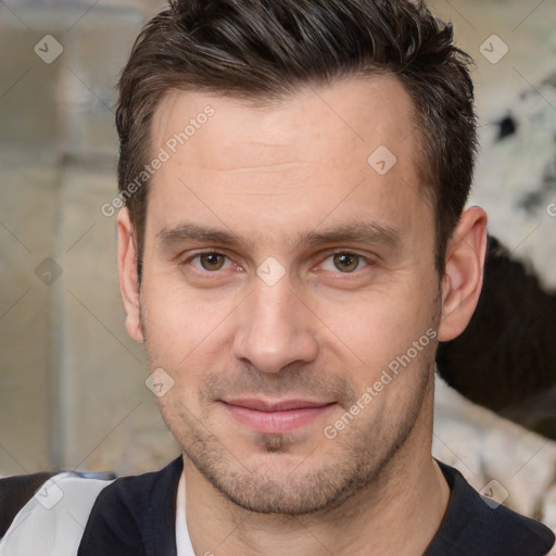 Joyful white adult male with short  brown hair and brown eyes