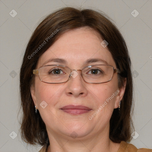 Joyful white adult female with medium  brown hair and blue eyes