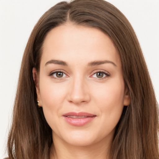 Joyful white young-adult female with long  brown hair and brown eyes