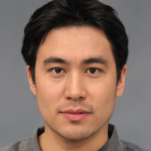 Neutral asian young-adult male with short  brown hair and brown eyes