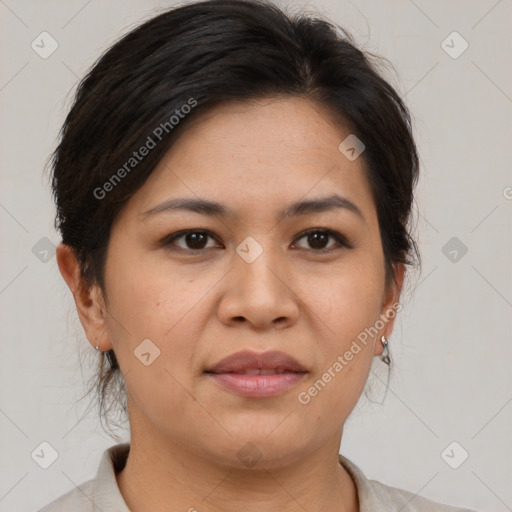 Joyful asian adult female with medium  brown hair and brown eyes