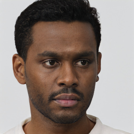 Neutral black young-adult male with short  black hair and brown eyes