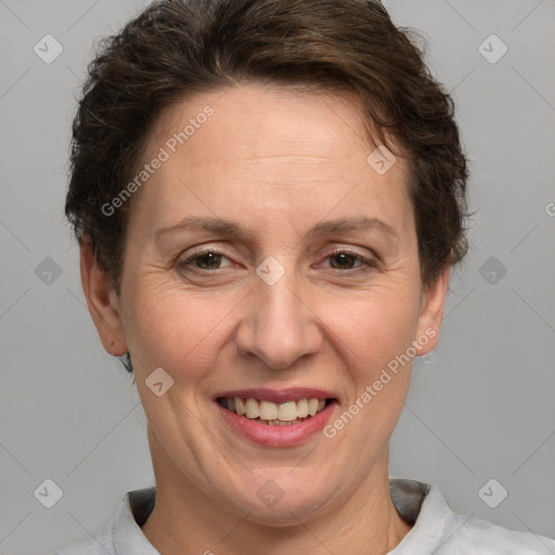 Joyful white adult female with short  brown hair and brown eyes