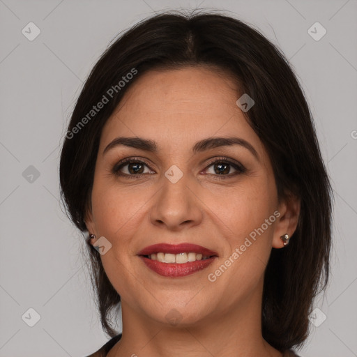 Joyful white adult female with medium  brown hair and brown eyes