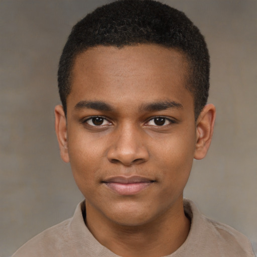 Joyful black young-adult male with short  brown hair and brown eyes