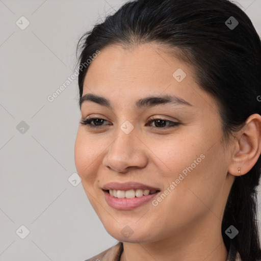 Joyful asian young-adult female with long  brown hair and brown eyes