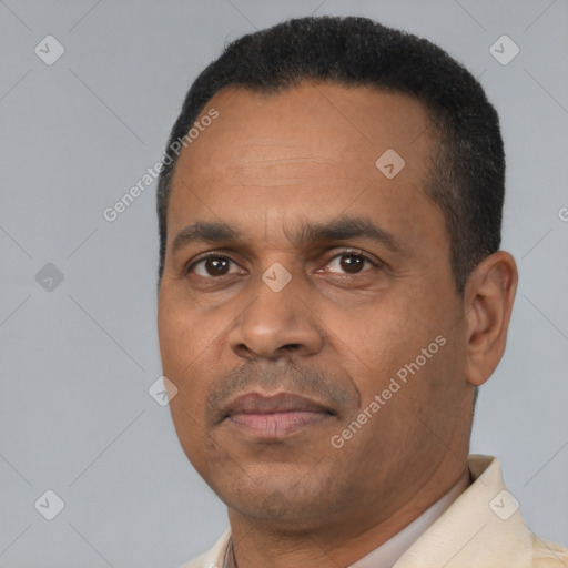 Neutral latino adult male with short  black hair and brown eyes