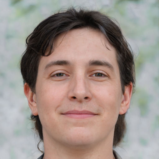 Joyful white young-adult male with medium  brown hair and brown eyes