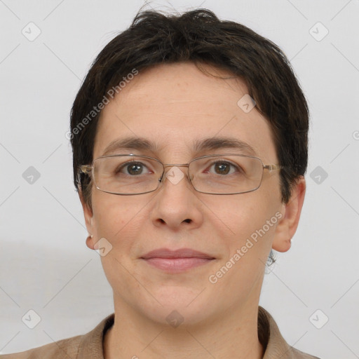 Joyful white adult female with short  brown hair and brown eyes