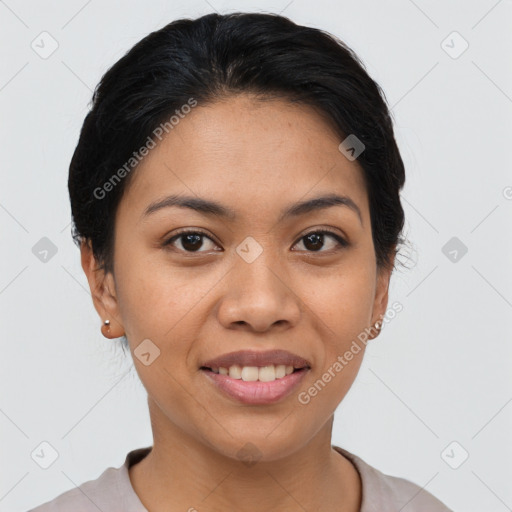 Joyful latino young-adult female with short  black hair and brown eyes